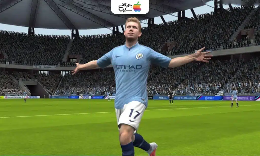 صفحه نمایش گوشی آیفون با تصویر بازی FIFA Mobile، نشان‌دهنده مسابقه فوتبالی با گرافیک واقع‌گرایانه و بازیکنان حرفه‌ای است.